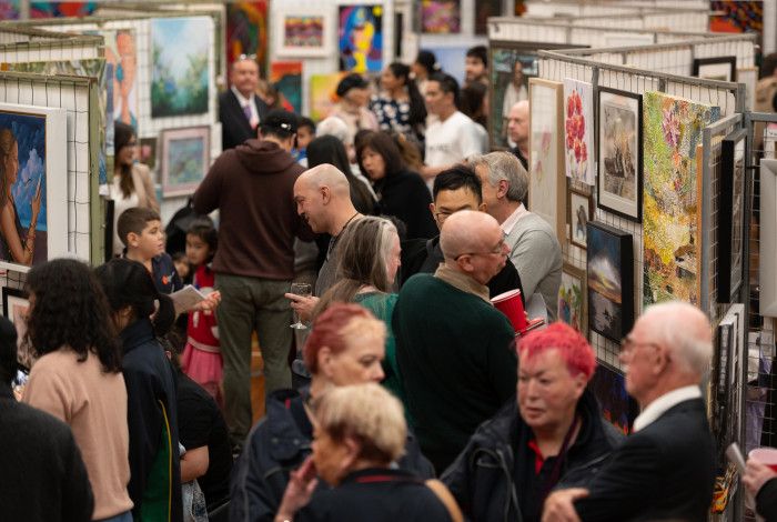 People enjoying an art show.