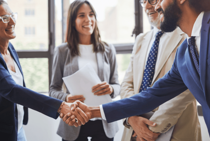 business people meeting and man shaking someone hand