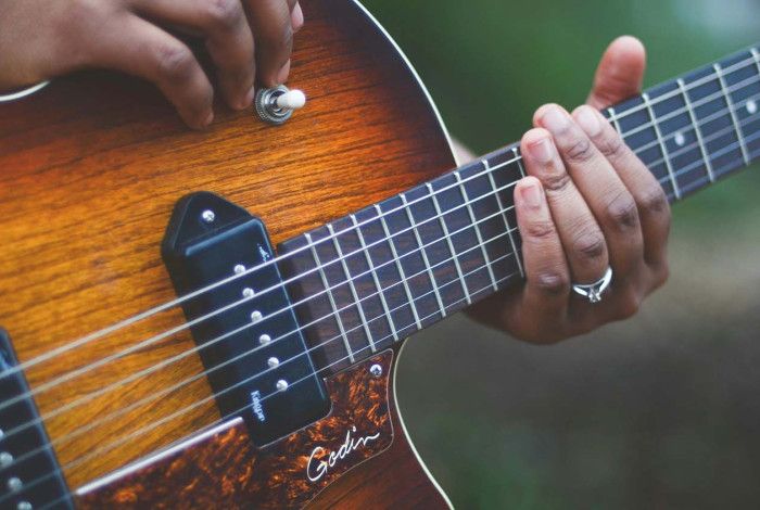 Someone playing a guitar