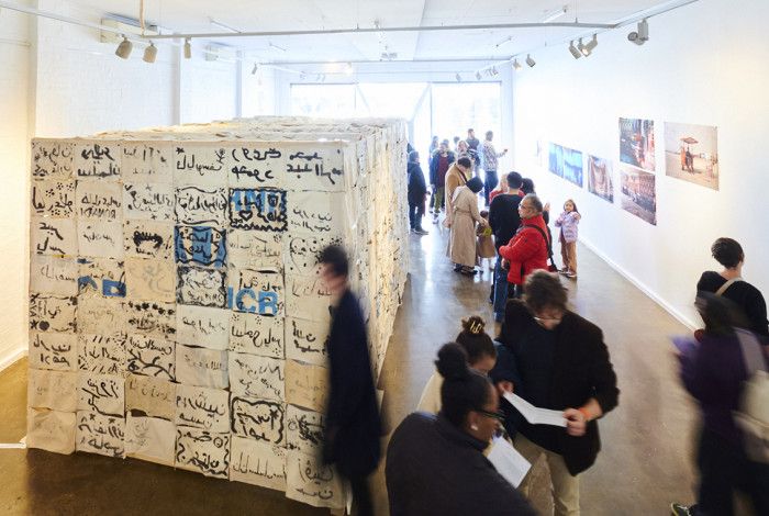 People looking at an art exhibition at the art gallery