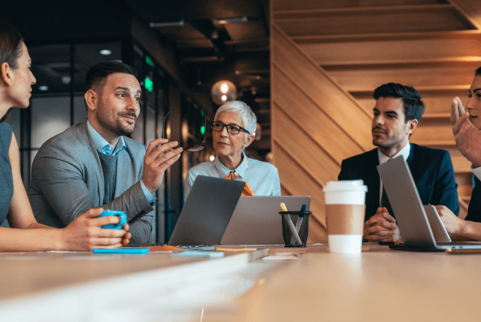 A group of professional people at a meeting.