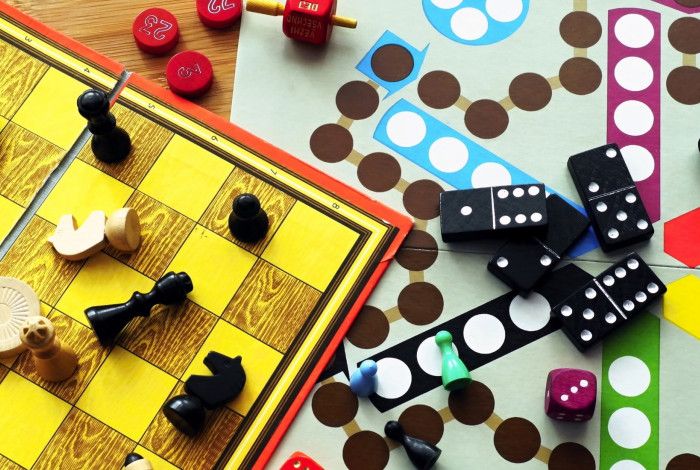 Board games spread out on table.
