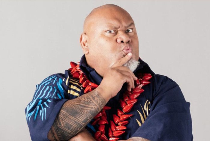 Tofiga Fepulea'i whith his hand to his mouth in a shushing gesture