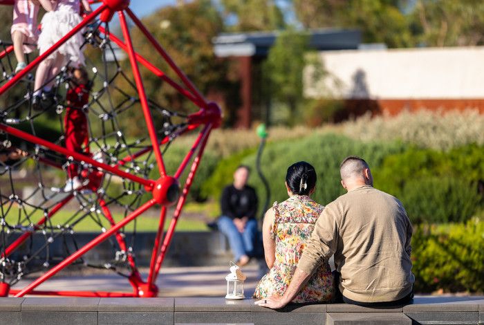 Parents sitting in a playground