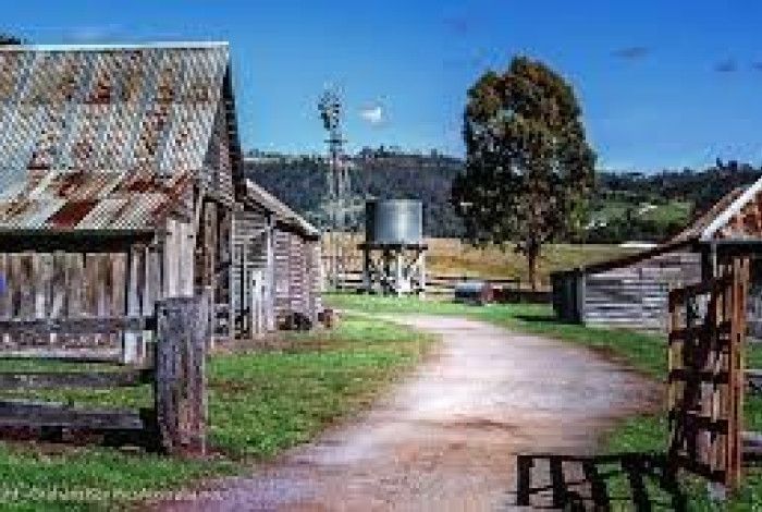 image of old buiding, water tank and windmill 