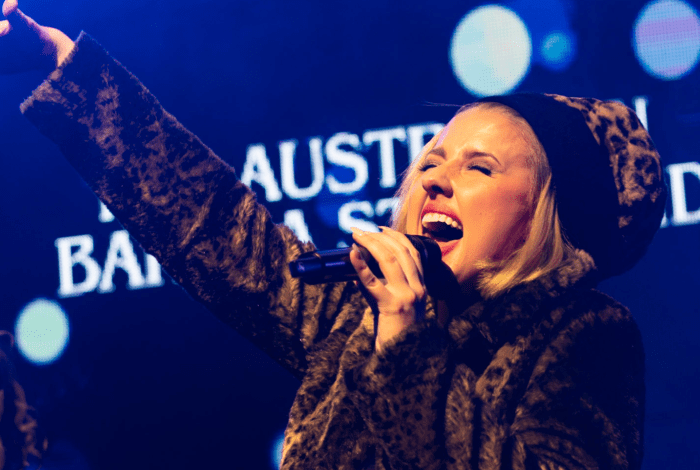 Rachael Grace performing at the Australian bandstand, delivering a tribute to Barbra Streisand's timeless music classics.