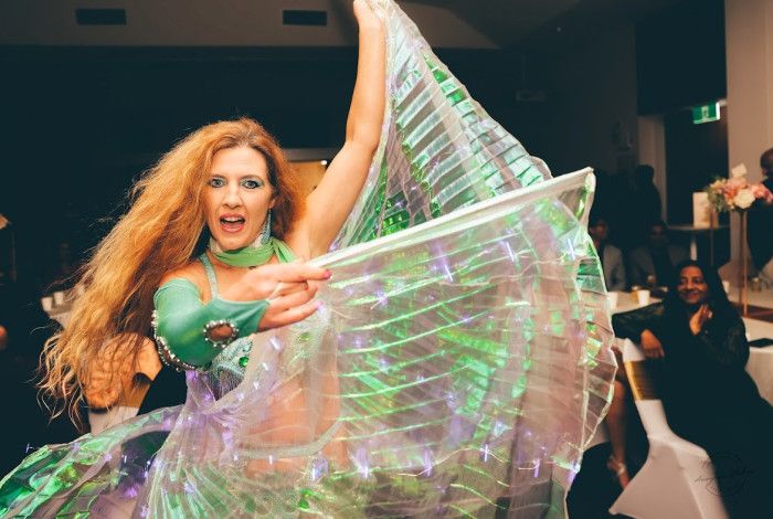 A woman belly dancing. 