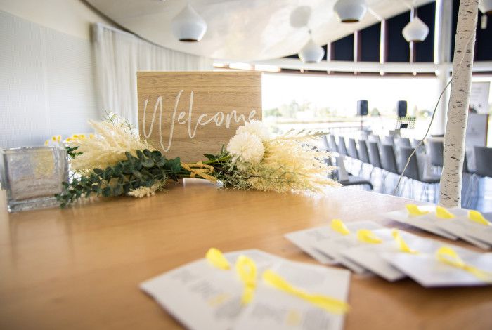 A welcome sign with flowers