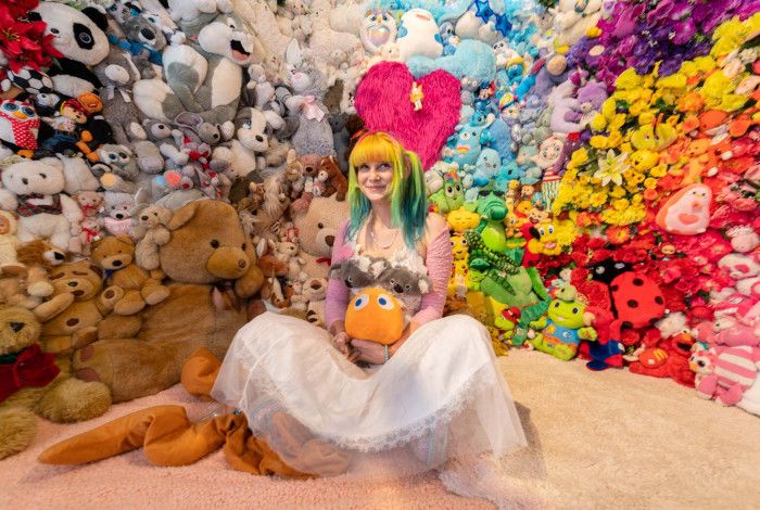 Moon Girle surrounded by toys.