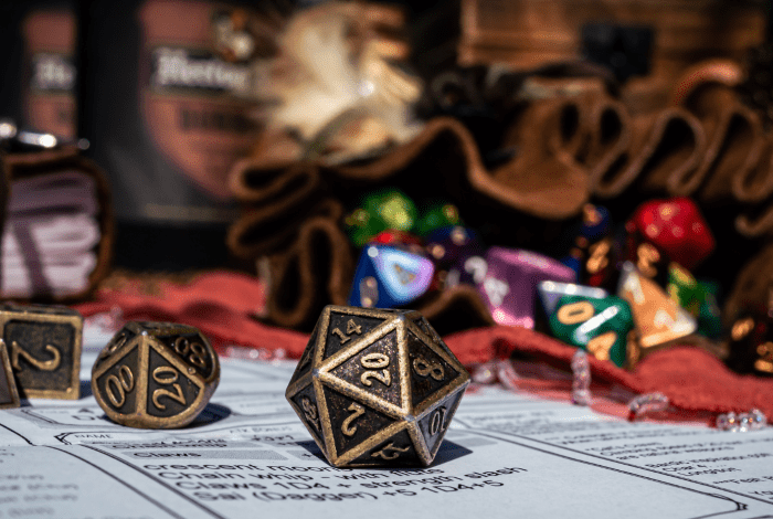 A tabletop role playing game setup with several multisided dice. 