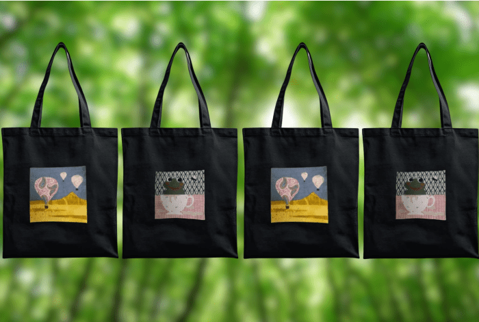 Tote bags with handmade illustrations on the side.