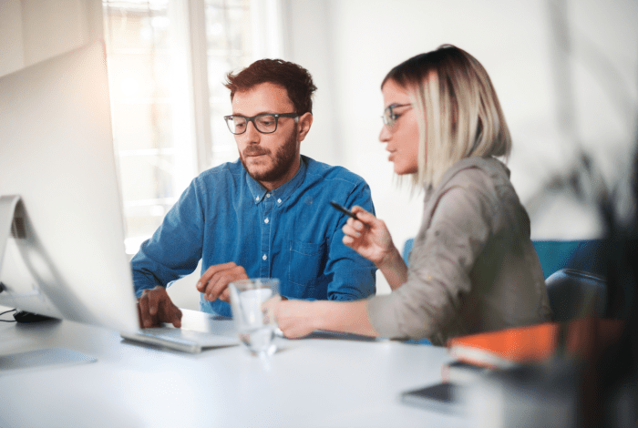male business owner holding ipad
