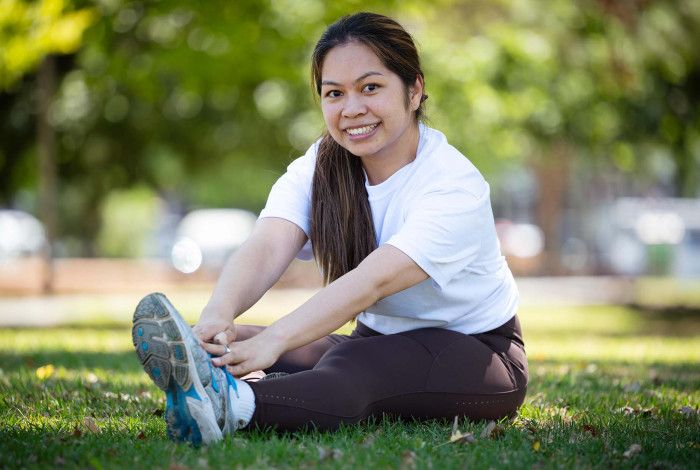 Councillor Melinda Yim exercising in a park