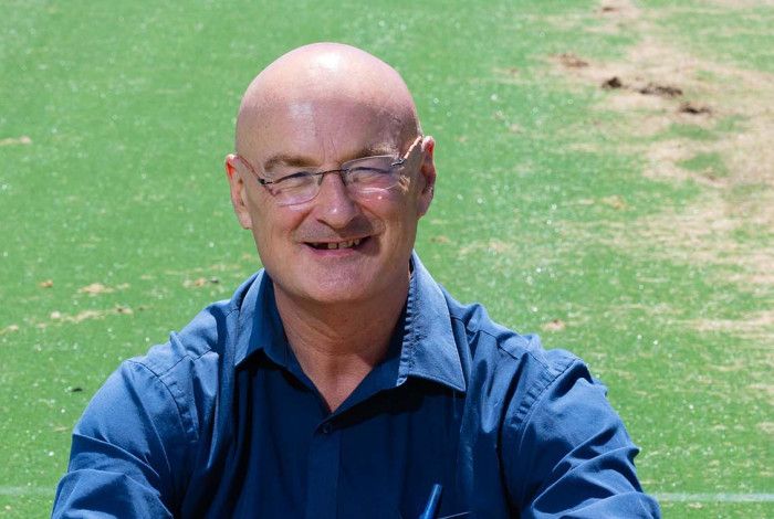 Cr Sean O'Reilly sitting on grass