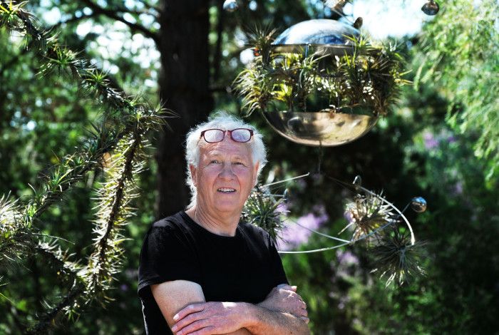 A man standing in front of trees
