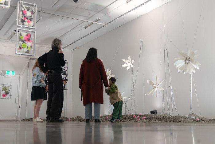 People looking at the exhibition at Walker Street Gallery 