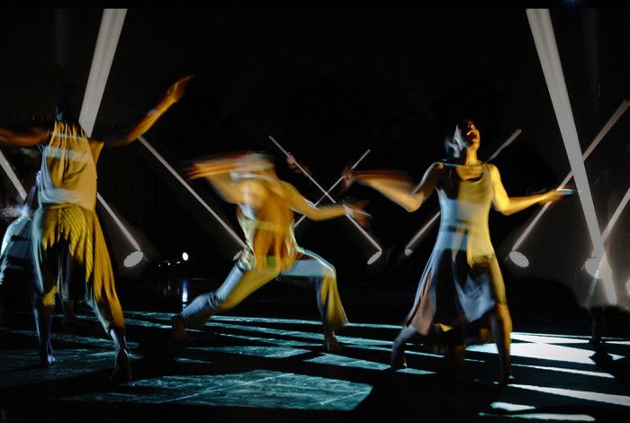 An abstract image of people dancing and screaming