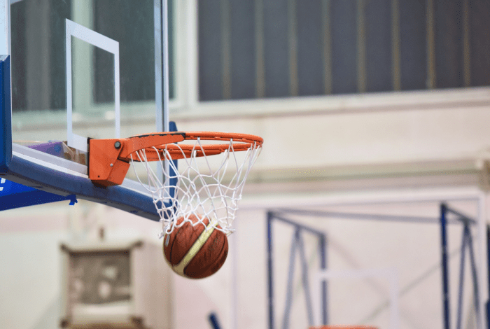 Basketball flying into a hoop