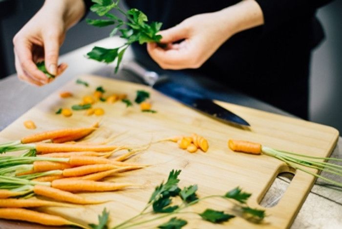 Person cutting vegetables