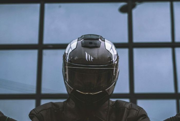 A person wearing a motorcycle helmet