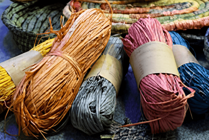 Colourful natural fibres and woven baskets used for First Nations weaving.