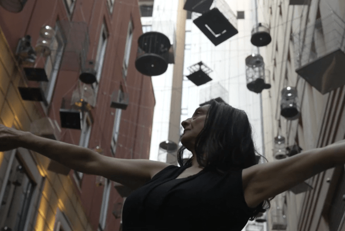 A lady with her hands in the air