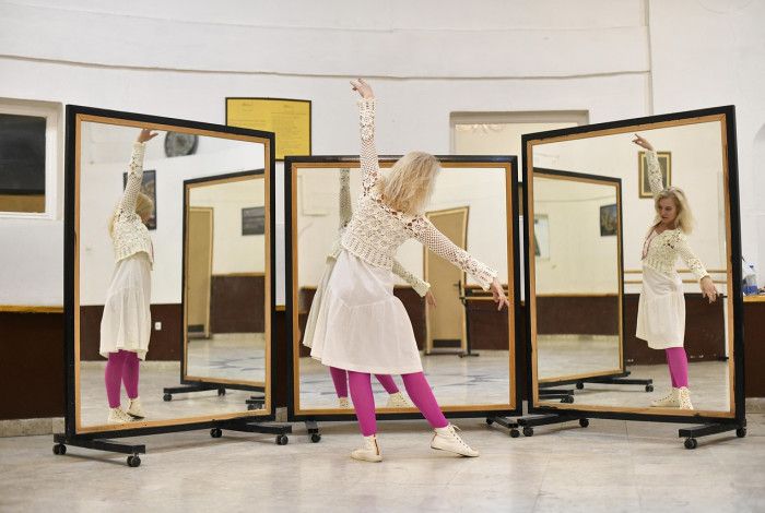 Someone dancing in front of a mirror