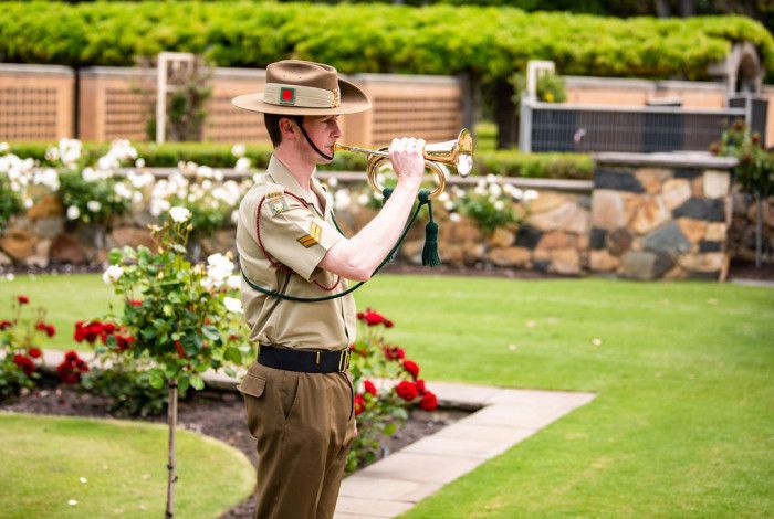 A solider playing the trumpet