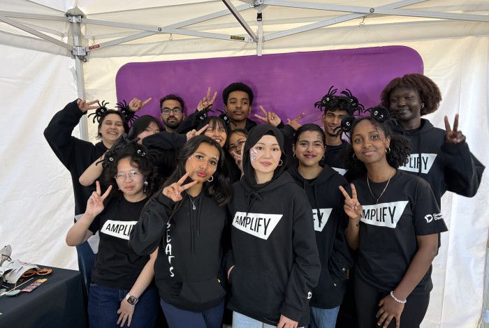 Image of a group of young people posing together for a photo.