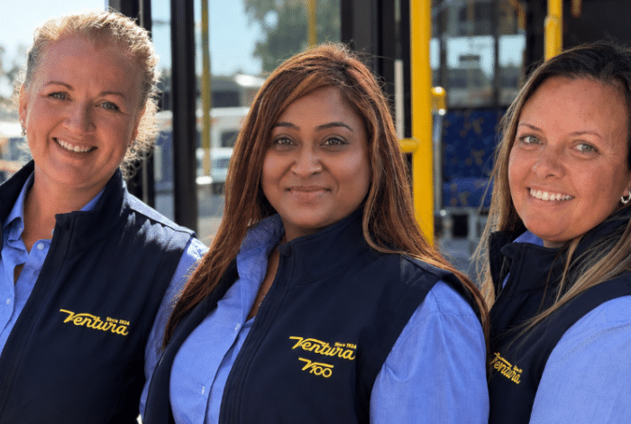 Three women smiling