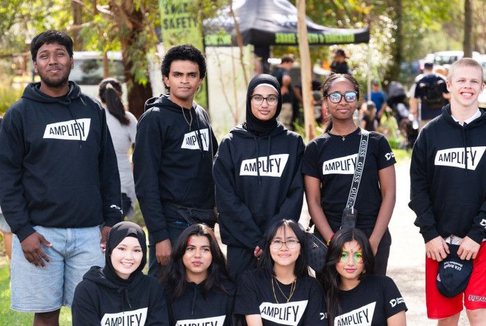 A group of young people smiling