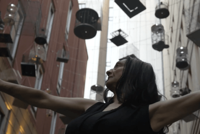 A woman with her hands in the air