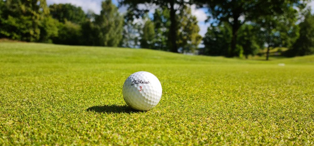 Golf ball in the middle of a green