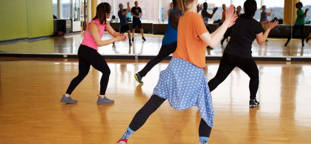 People exercising in a room.