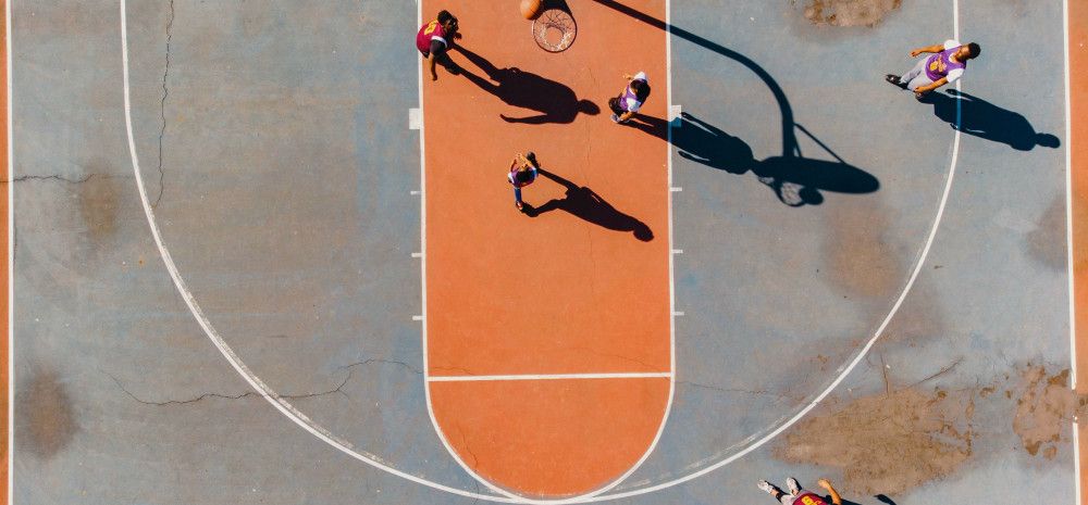 People playing basketball in the court