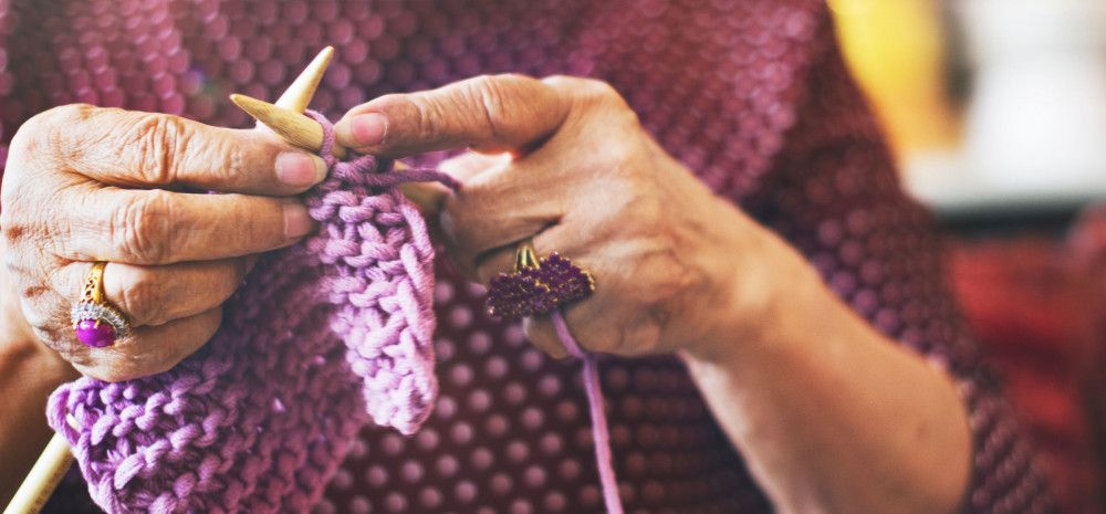 Image of a person knitting