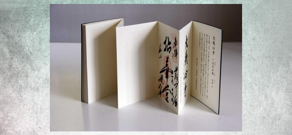 folding concertina book on grey background