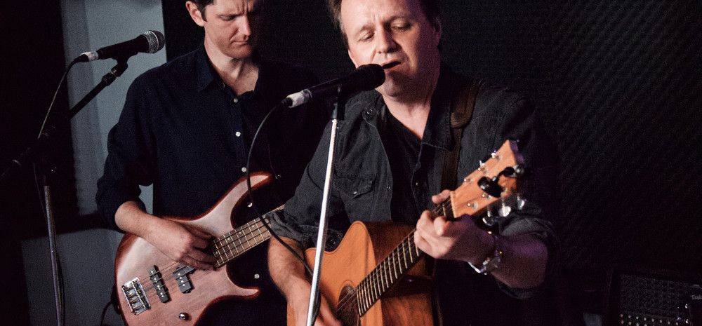 Men playing guitars