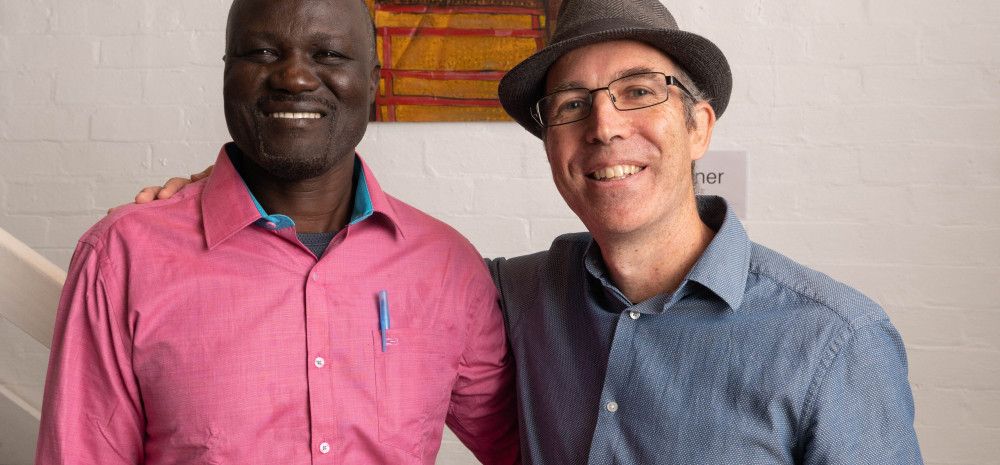 Artist and subject: Gora Odiel and Gabriel Hingley in front of the winning portrait. 