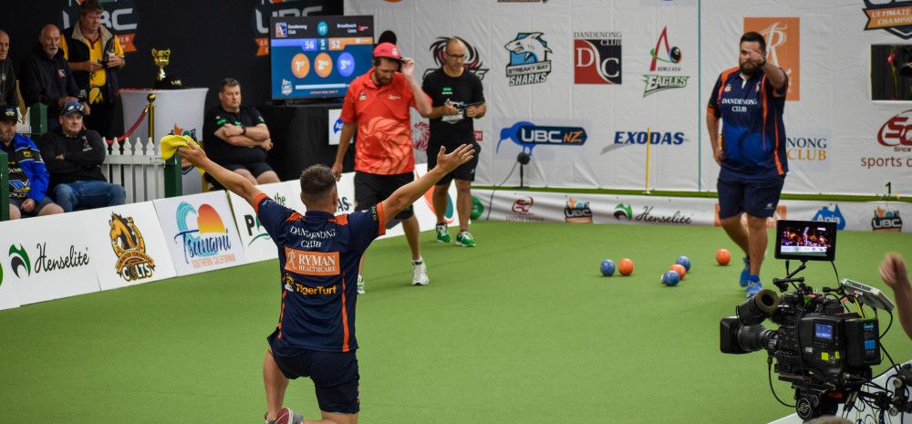 Men playing lawn bowls