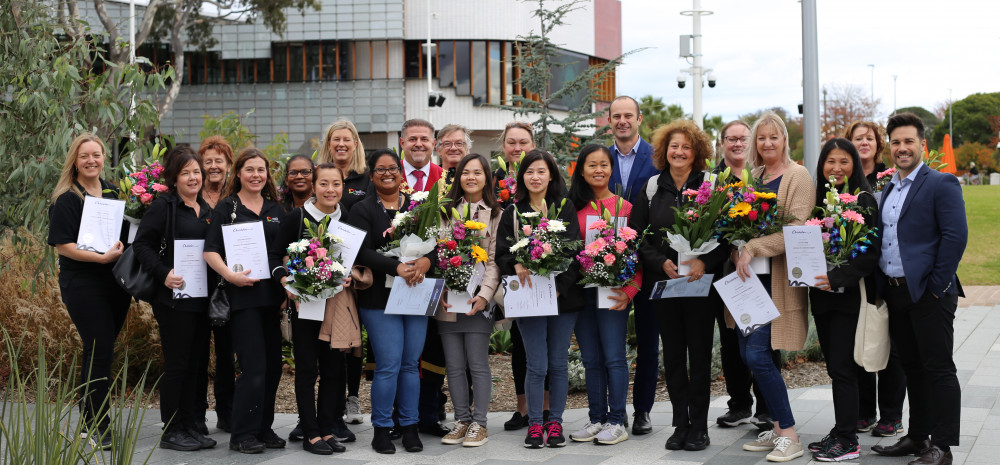 Mayor Jim Memeti with a large group of graduates Council workers.