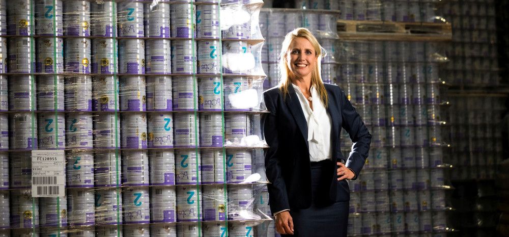 Lady standing in front of baby formula