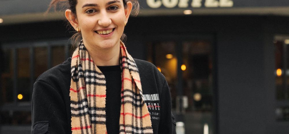 Lady in front of coffee shop