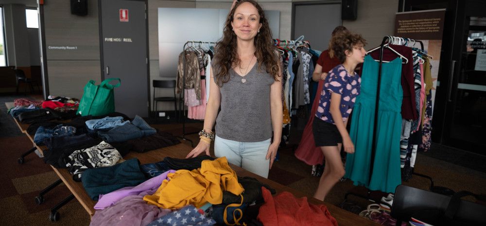 Person standing in front of a clothing stall