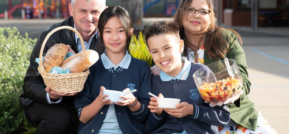 Teachers and students share a healthy breakfast