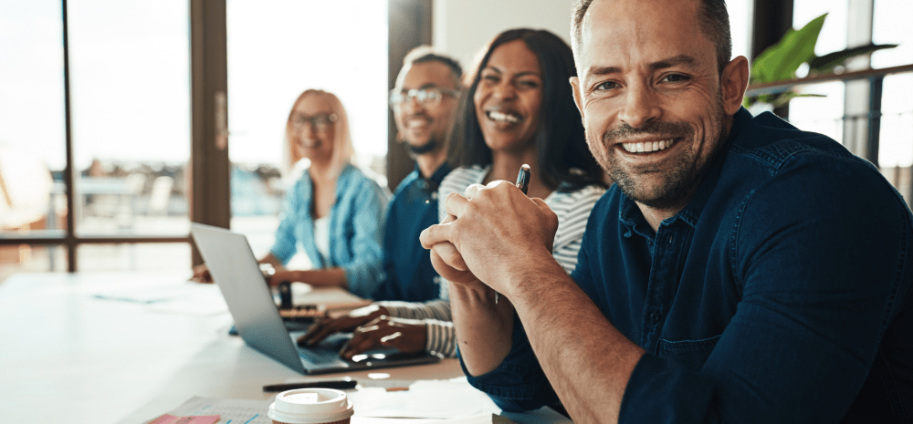 People sitting at a table in an office 