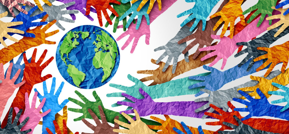 multicoloured paper hands around a globe