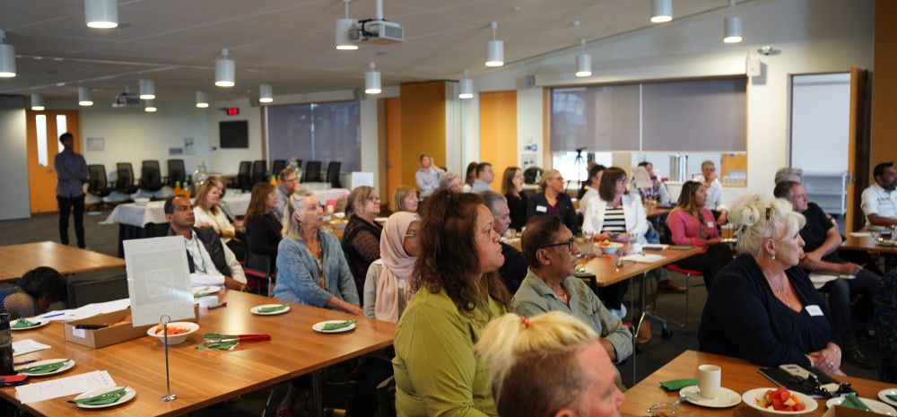 a group of people at a conference 