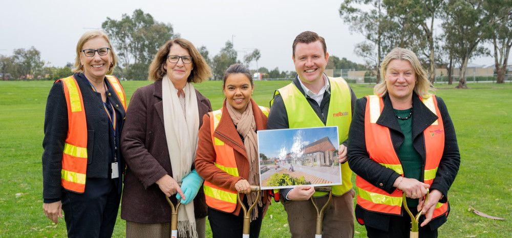 image of people in high vis with shovels