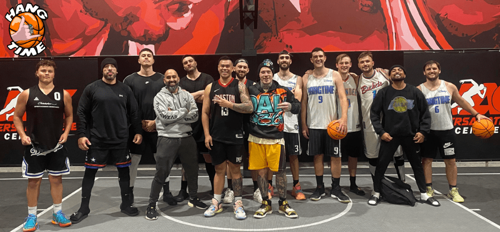 People standing and holding basketballs